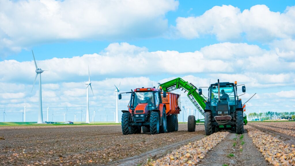 Tractor on the land, Harvesting machine tractor working in the field. Combine harvester machine
